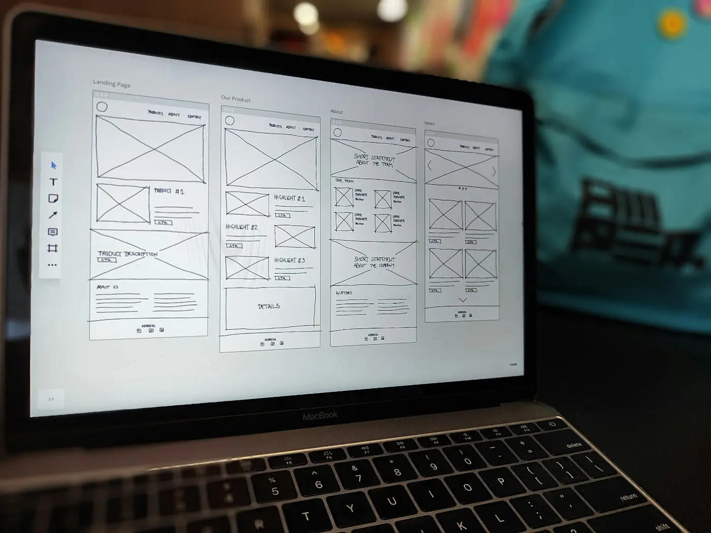 Laptop showing wireframes of a website structure