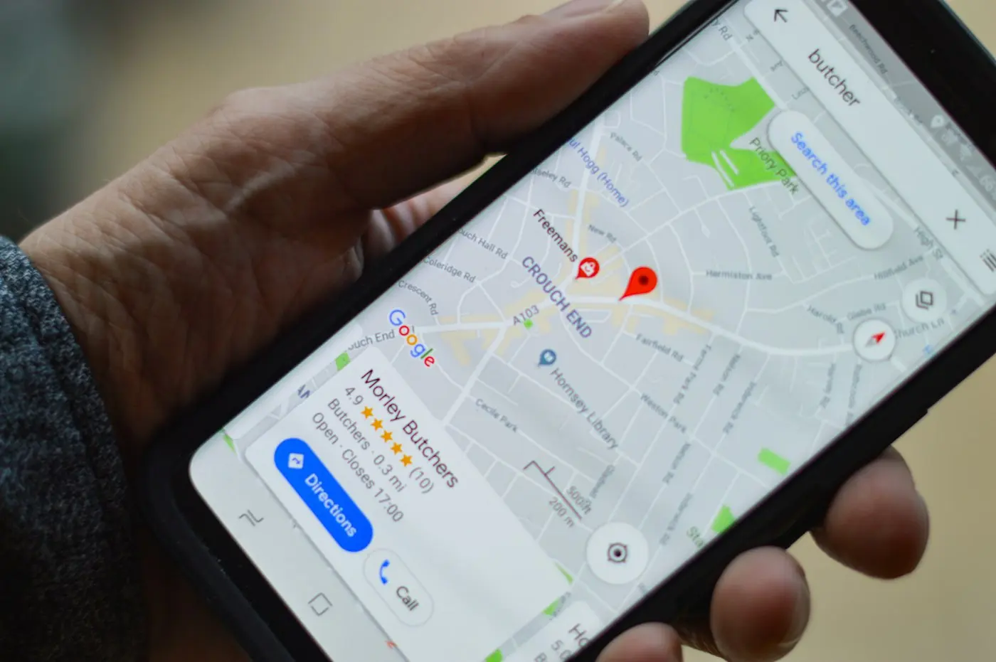 Phone showing a map and a business listing